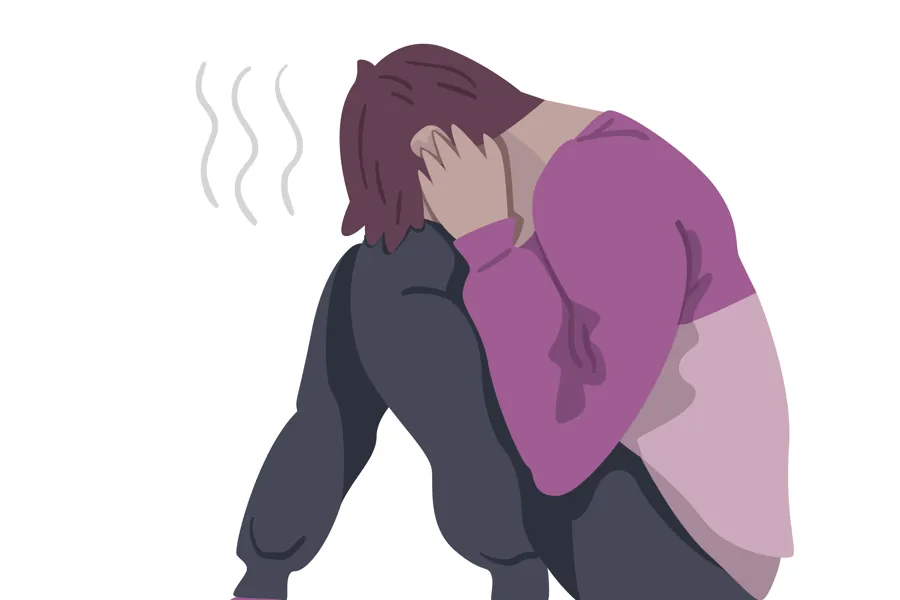 En person med hånden i ansiktet